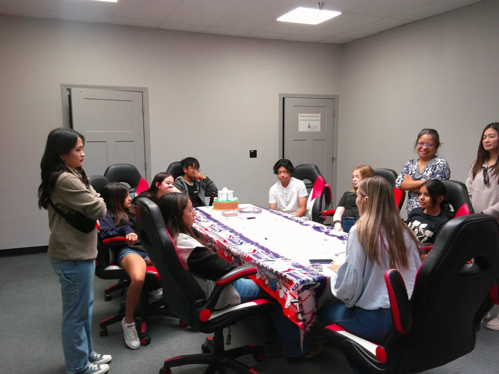 Group of kids post game escape room celebrating birthday party at Think in a Box San Angelo, TX.