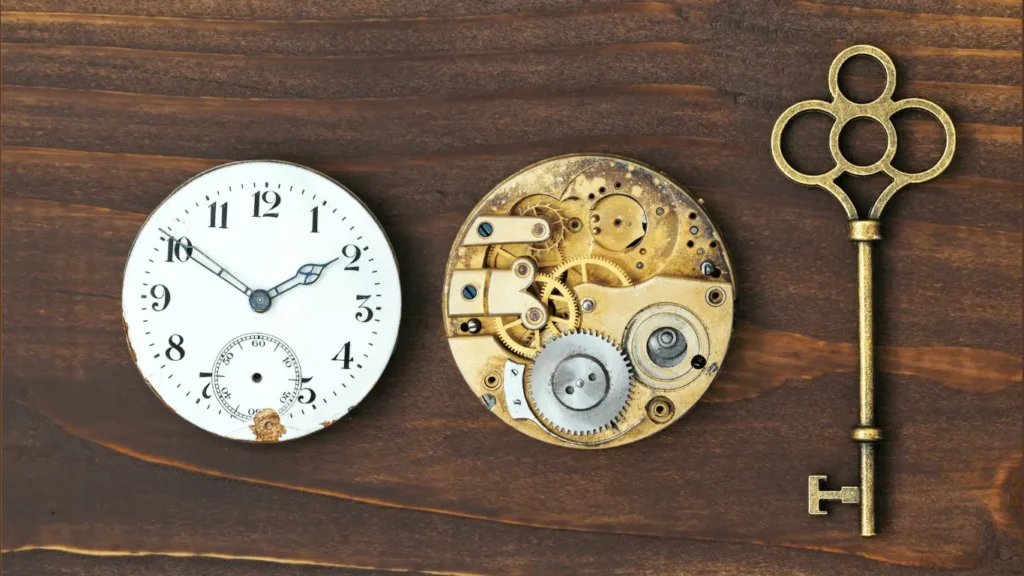 Vintage clock, exposed gears, and antique key representing the evolution of escape rooms from simple puzzles to immersive experiences.